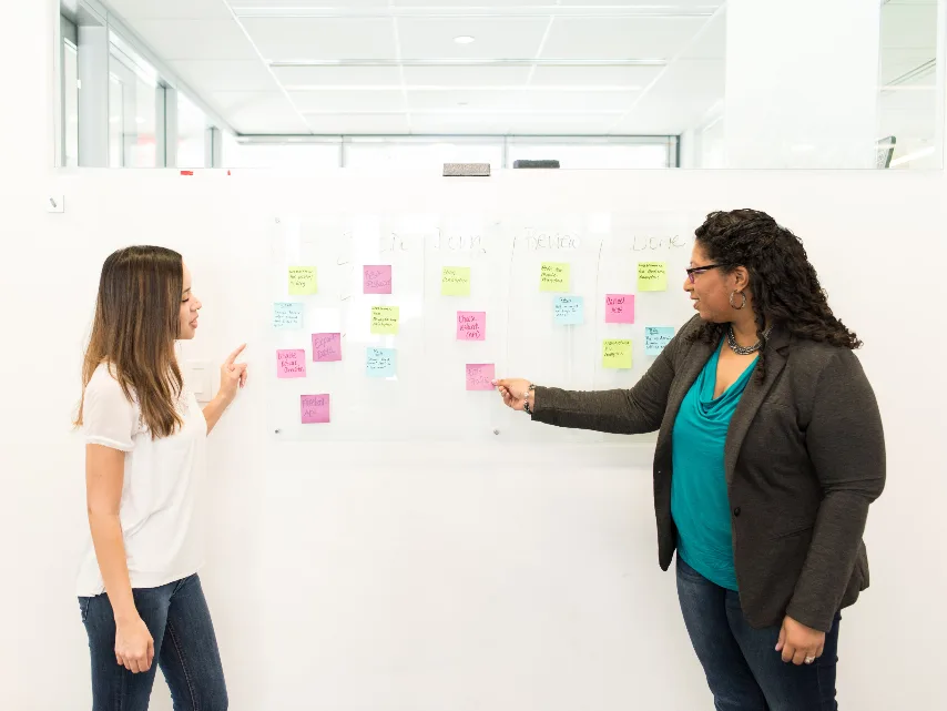 Team planning on a wall of sticky notes, Alori app for agencies