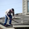 Roofer at work on a roof, Alori app for roofing